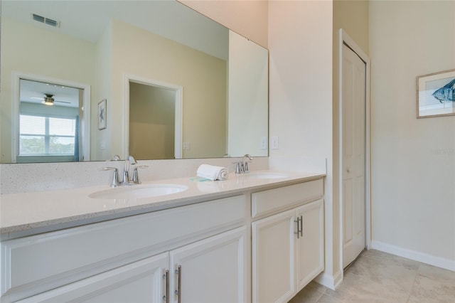 bathroom featuring dual sinks, tile floors, ceiling fan, and oversized vanity