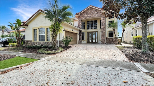 view of front of house featuring french doors and a garage