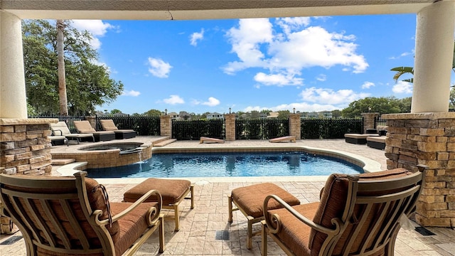 view of swimming pool featuring an in ground hot tub and a patio