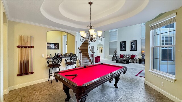 recreation room with billiards, an inviting chandelier, tile flooring, and a raised ceiling