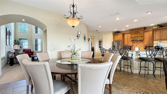 dining room featuring light colored carpet