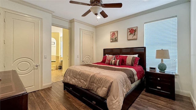 bedroom featuring dark hardwood / wood-style floors, crown molding, ceiling fan, and ensuite bath