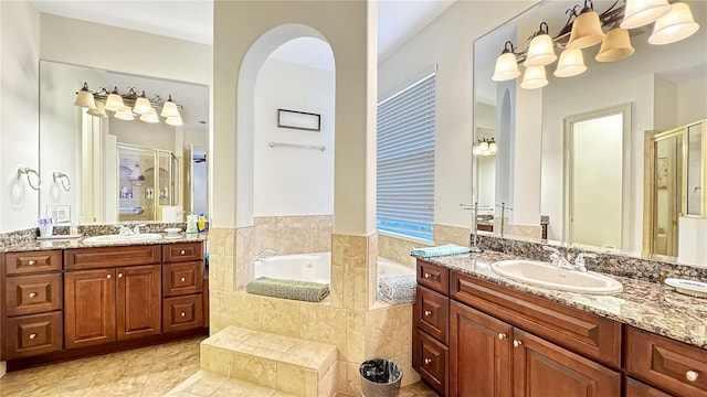 bathroom with tile flooring, independent shower and bath, and double vanity