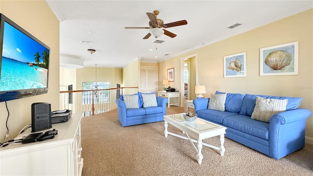 carpeted living room with crown molding and ceiling fan with notable chandelier