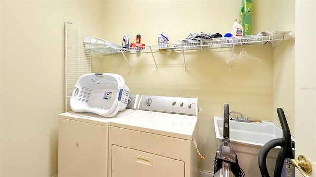 washroom with washing machine and clothes dryer