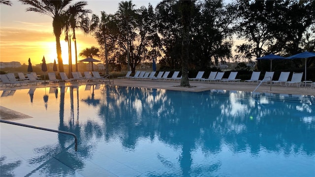 view of pool at dusk