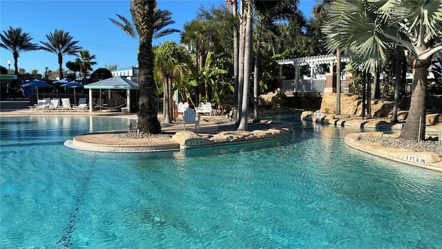 view of pool featuring a pergola and a gazebo