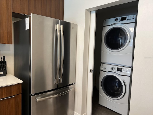 washroom with stacked washer and clothes dryer