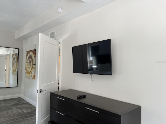 interior details featuring hardwood / wood-style flooring and a textured ceiling