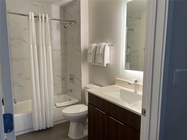 full bathroom with vanity, wood-type flooring, shower / tub combo with curtain, and toilet