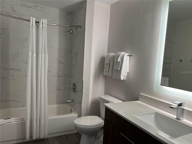 full bathroom with vanity, wood-type flooring, shower / tub combo, and toilet