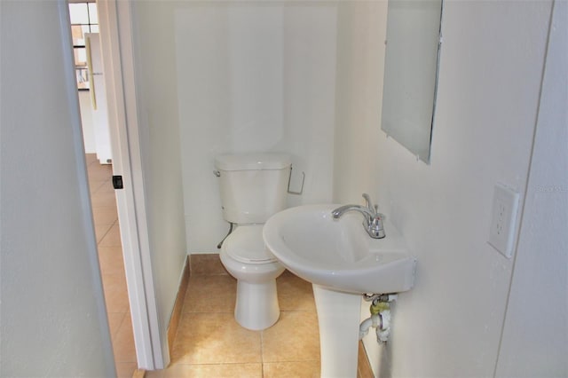 bathroom with tile floors and toilet