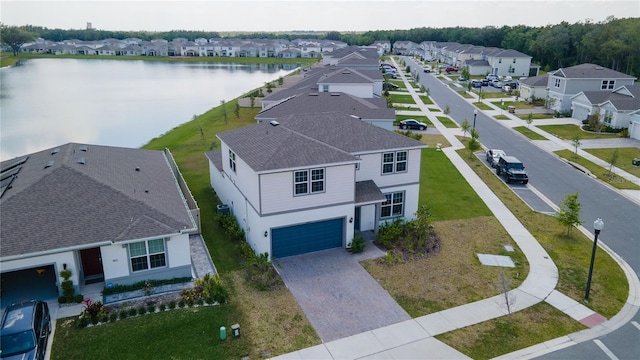 aerial view featuring a residential view and a water view