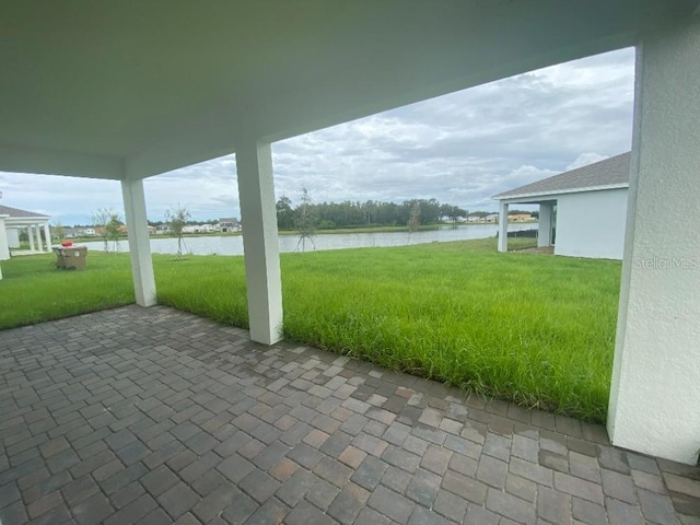 view of patio featuring a water view