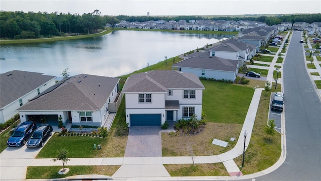 bird's eye view with a residential view and a water view