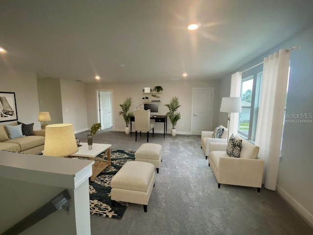 living room with recessed lighting and baseboards