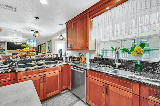 kitchen with stainless steel dishwasher, dark stone counters, a textured ceiling, hanging light fixtures, and sink