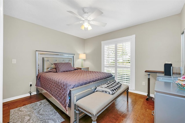 bedroom with dark hardwood / wood-style floors and ceiling fan