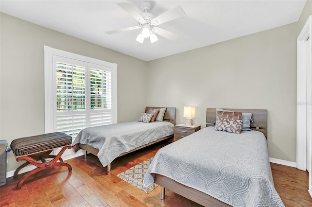 bedroom featuring ceiling fan and hardwood / wood-style flooring