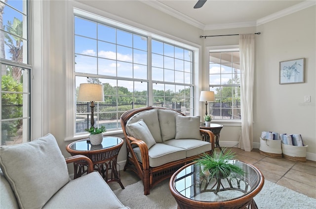 living area with ceiling fan, light tile patterned floors, and ornamental molding