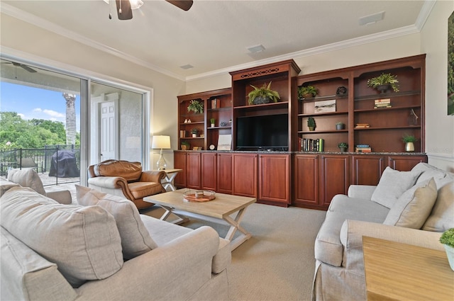 carpeted living room featuring ceiling fan and crown molding