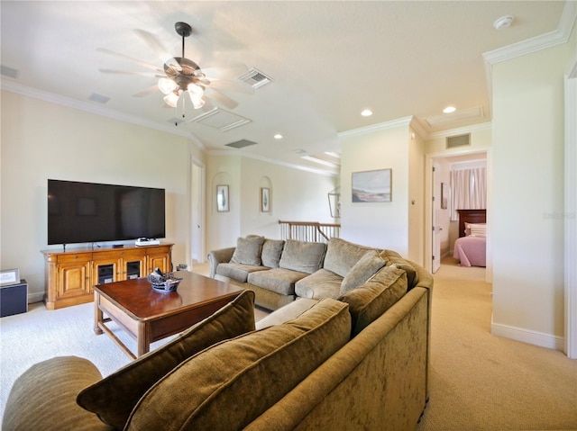 carpeted living room featuring ceiling fan and crown molding