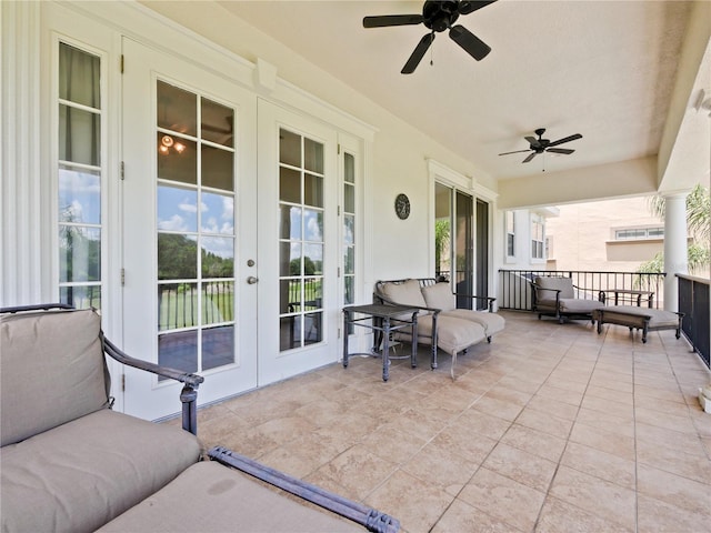 view of patio / terrace featuring ceiling fan, outdoor lounge area, and french doors