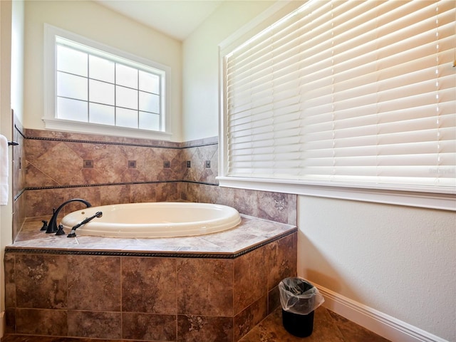 bathroom with tiled tub