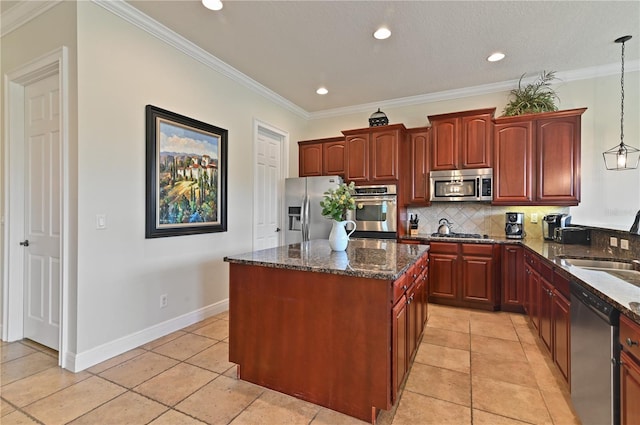 kitchen with crown molding, stainless steel appliances, pendant lighting, and decorative backsplash