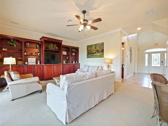 carpeted living room featuring ceiling fan and ornamental molding