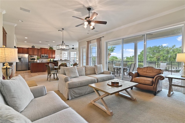 living room featuring ceiling fan with notable chandelier and ornamental molding