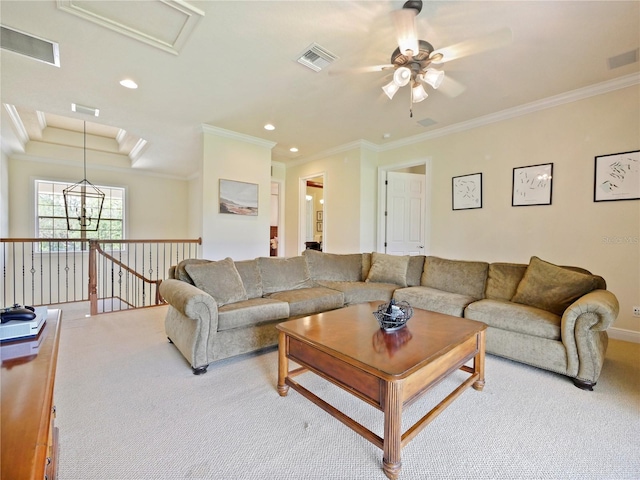 living room featuring ceiling fan, ornamental molding, and carpet floors