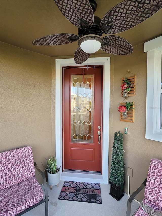 property entrance featuring stucco siding