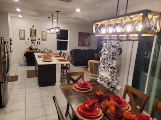 dining room with light tile patterned floors and recessed lighting