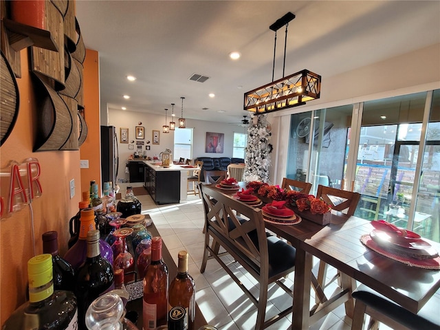 dining area with light tile patterned floors, visible vents, a ceiling fan, and recessed lighting