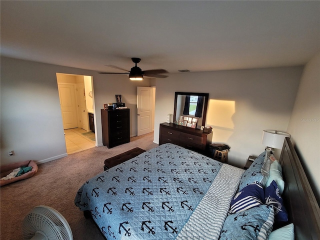 bedroom with visible vents, light carpet, baseboards, and ceiling fan