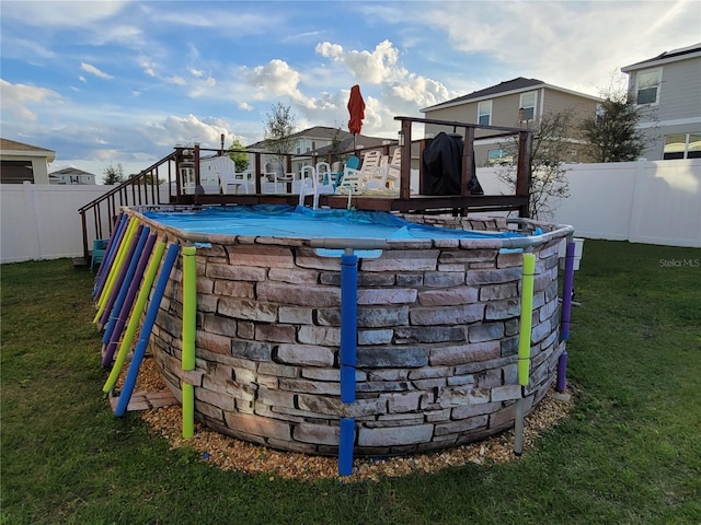 exterior space featuring a lawn and a fenced backyard