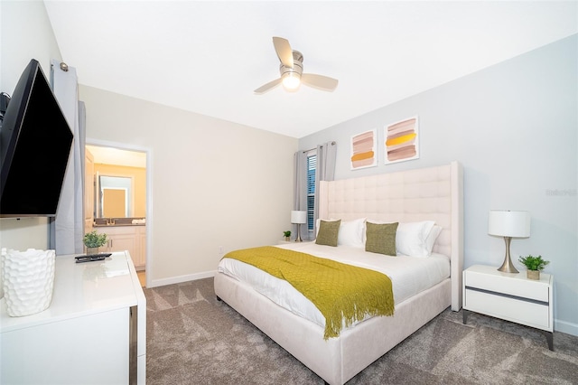 carpeted bedroom featuring connected bathroom and ceiling fan