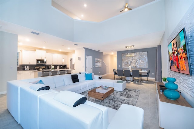 living room with a towering ceiling