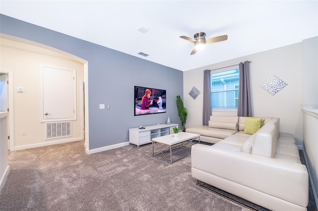 living room featuring carpet flooring and ceiling fan