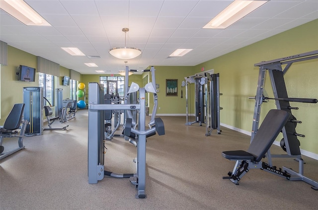 workout area featuring a paneled ceiling