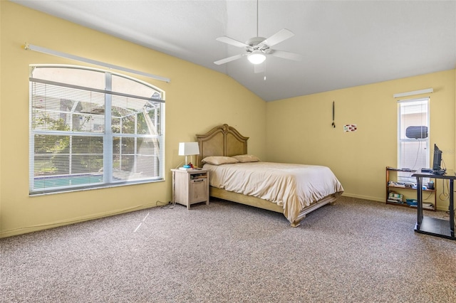 bedroom with carpet, vaulted ceiling, multiple windows, and ceiling fan