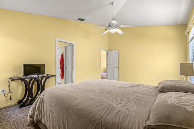 carpeted bedroom with lofted ceiling and ceiling fan