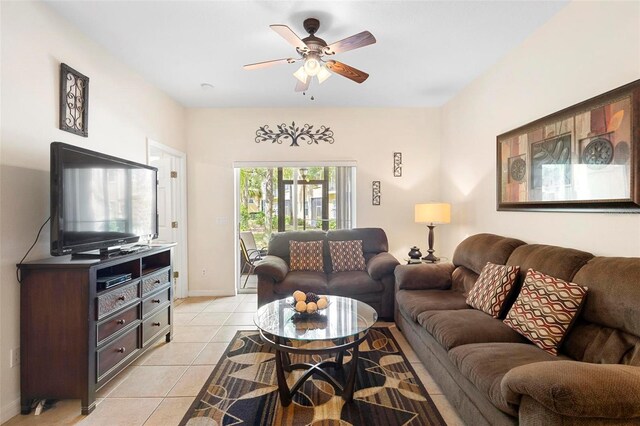 tiled living room featuring ceiling fan