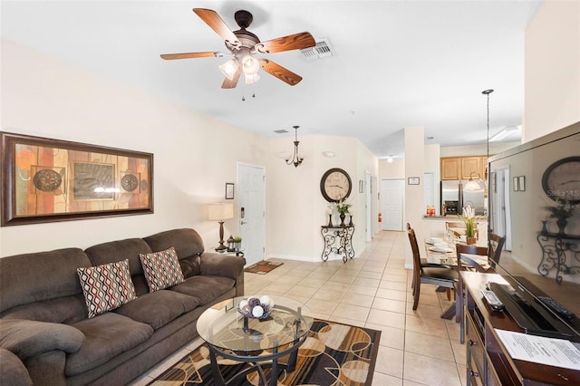 living room with light tile floors and ceiling fan