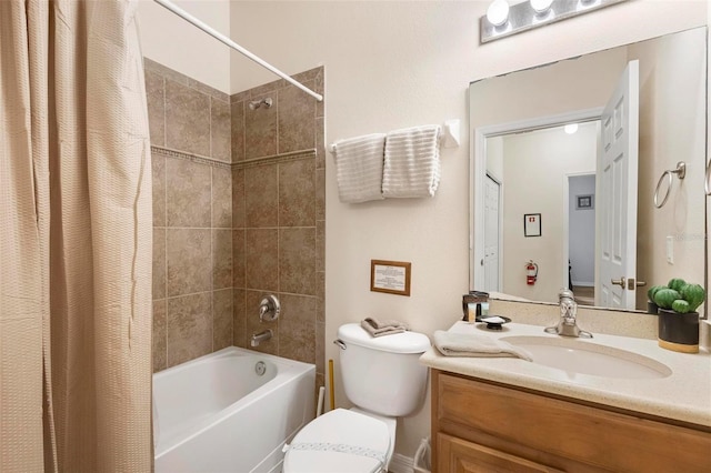 full bathroom with vanity, shower / bath combination with curtain, and toilet