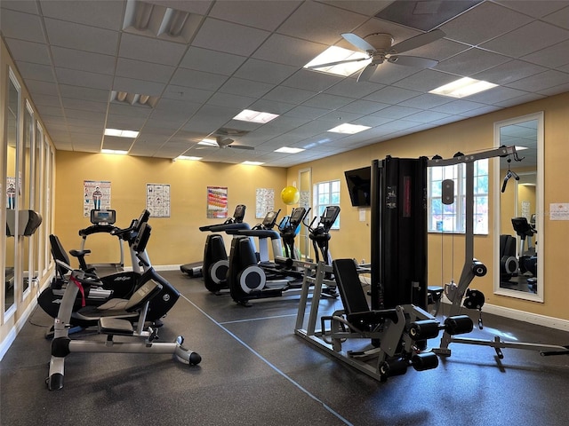 workout area featuring a drop ceiling and ceiling fan