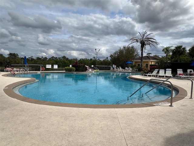 view of swimming pool featuring a patio area