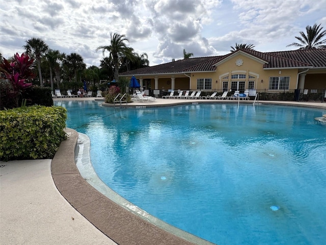 view of swimming pool with a patio