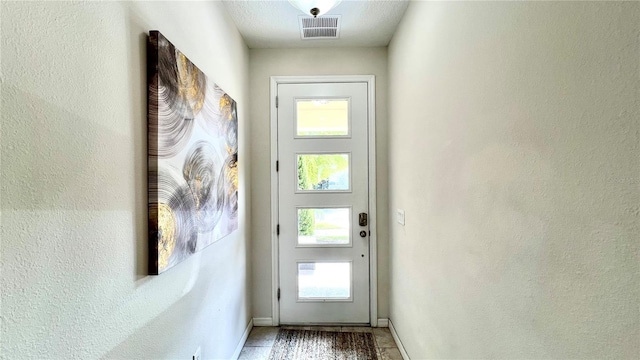 entryway featuring tile flooring